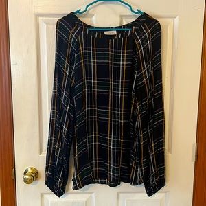 Woman’s black, yellow and purple flannel blouse